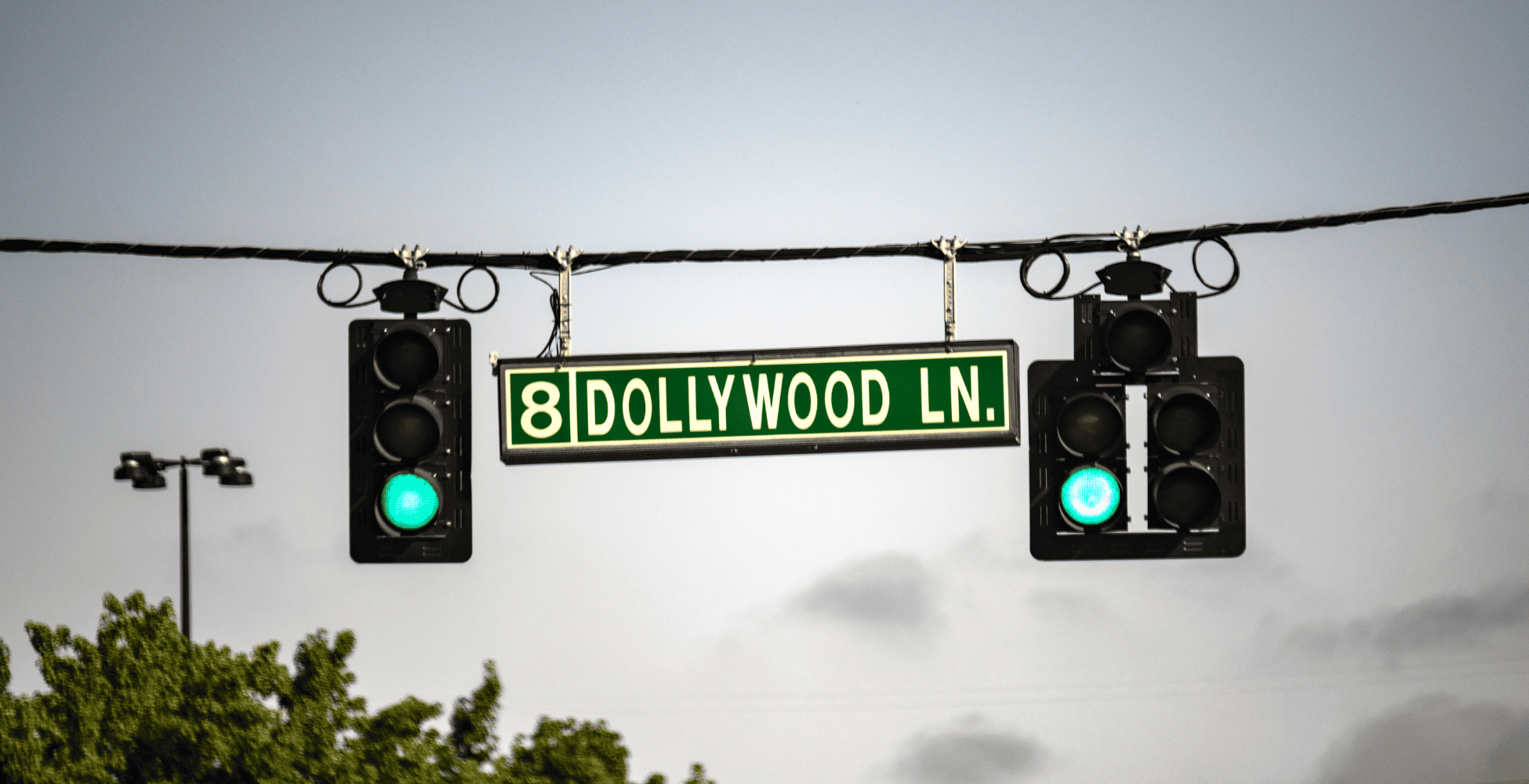 an american style sign with dollywood written on it